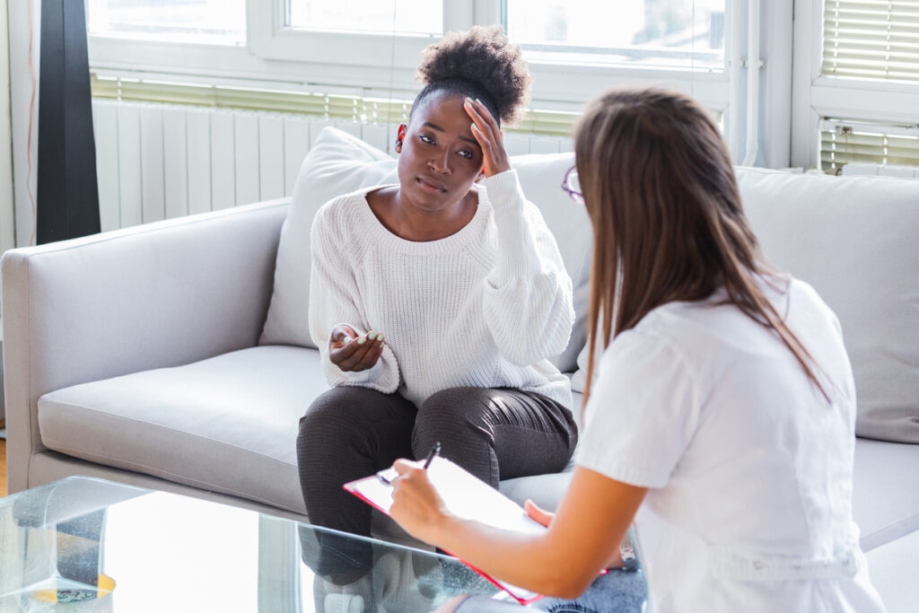 Female patient and therapist talk to each other